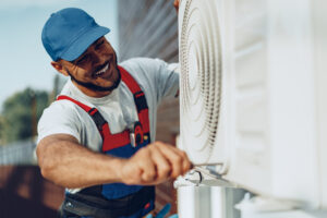 AC serviceman performs spring maintenance
